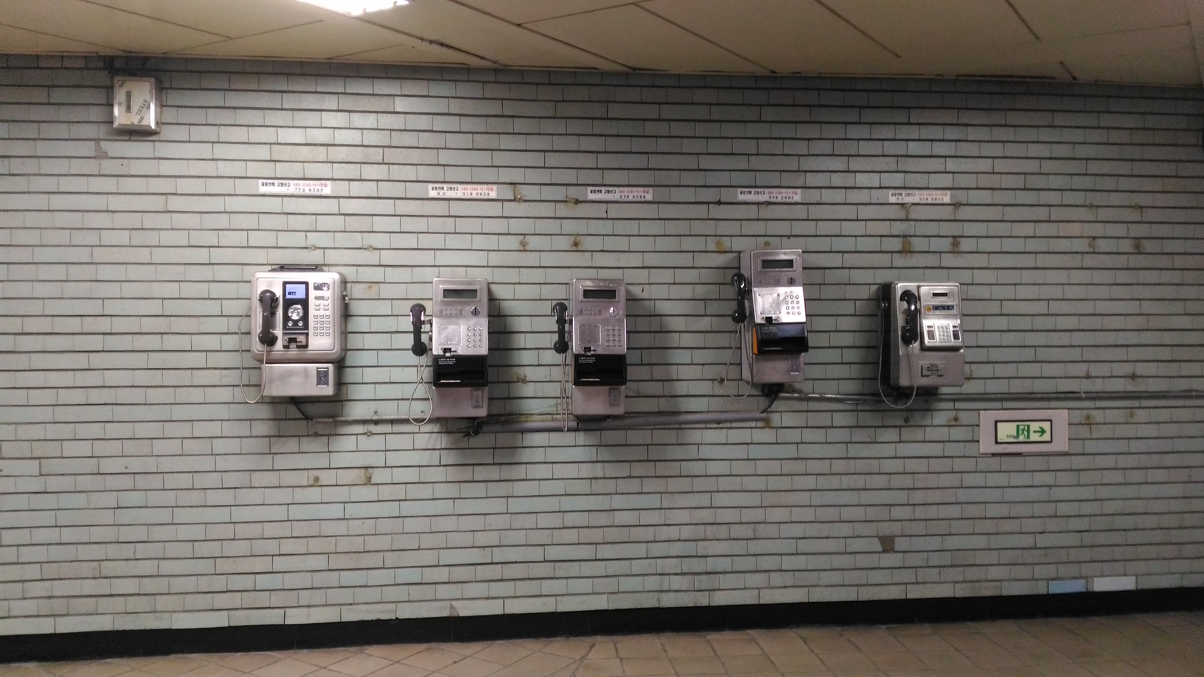 Plain Old Telephones inside a metro station.
