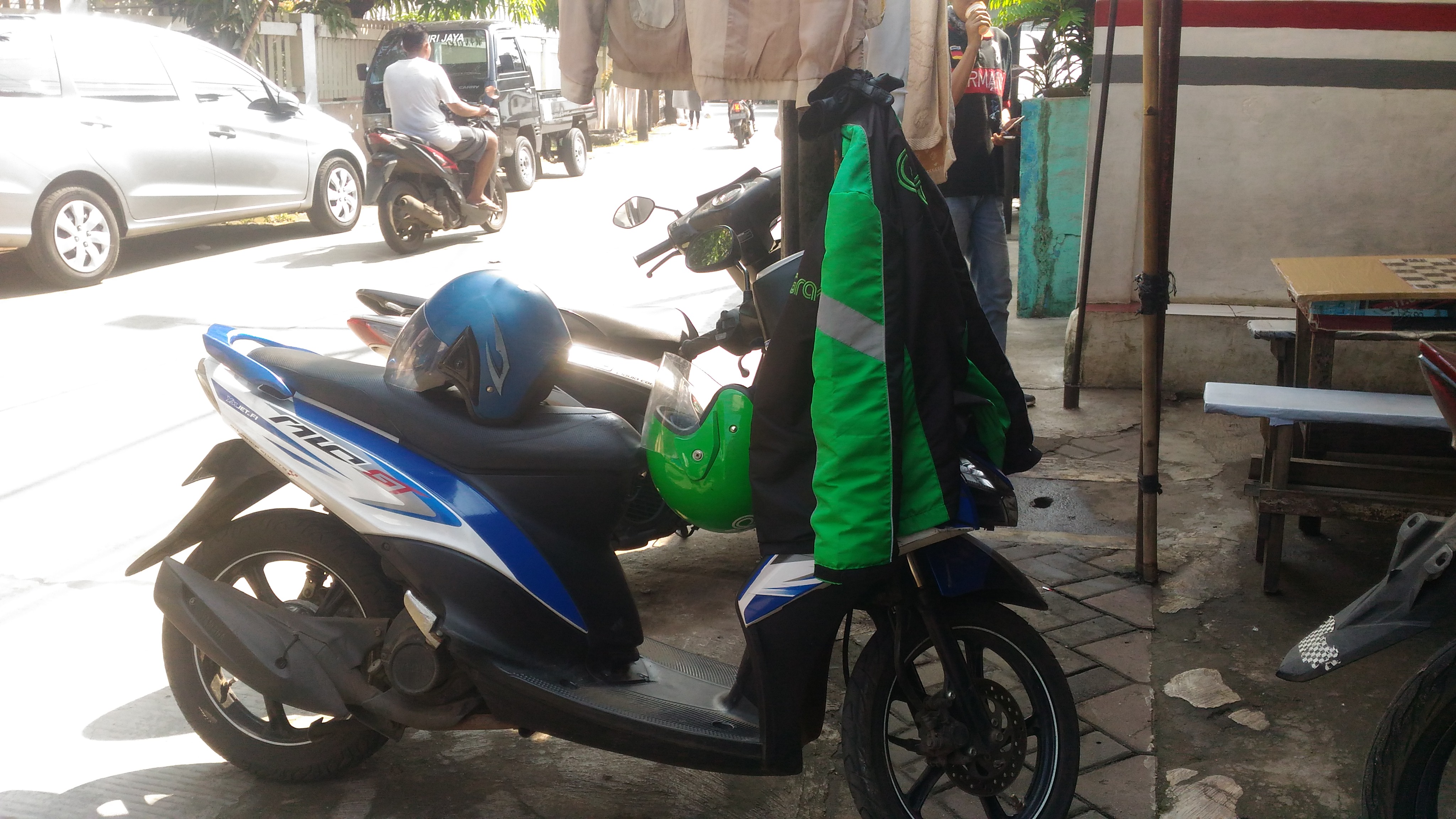 GO-JEK is probably the most popular way to get around in Jakarta. Here the driver had stopped for tea.