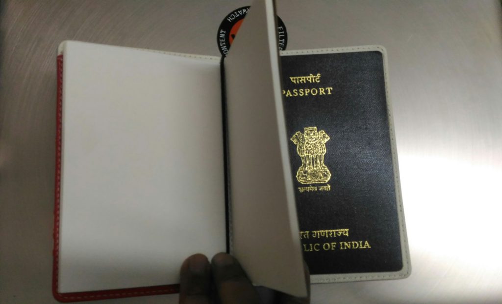 Attaching the notebook to passport holder is easy using an elastic band.