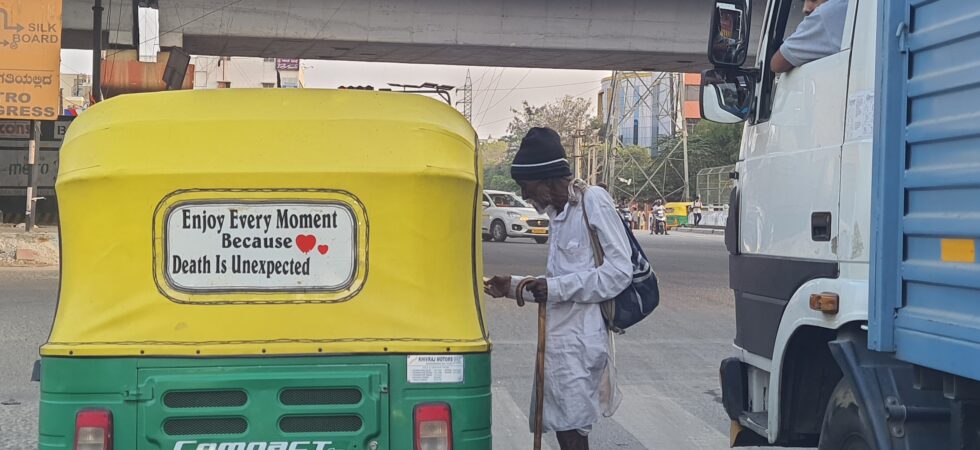 Auto with the board " Enjoy every moment because death is unexpected"